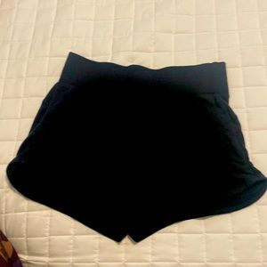 Athleta Womens black loose fitting jersey material shorts with pockets